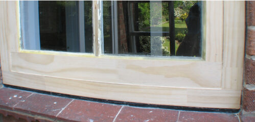 A restoration project of sash windows with wooden frames.