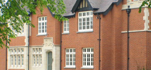 A large red brick building with sash windows repairs in Croydon.